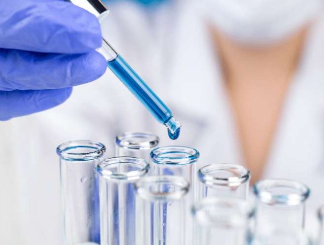 Photo of lab technician doing water testing