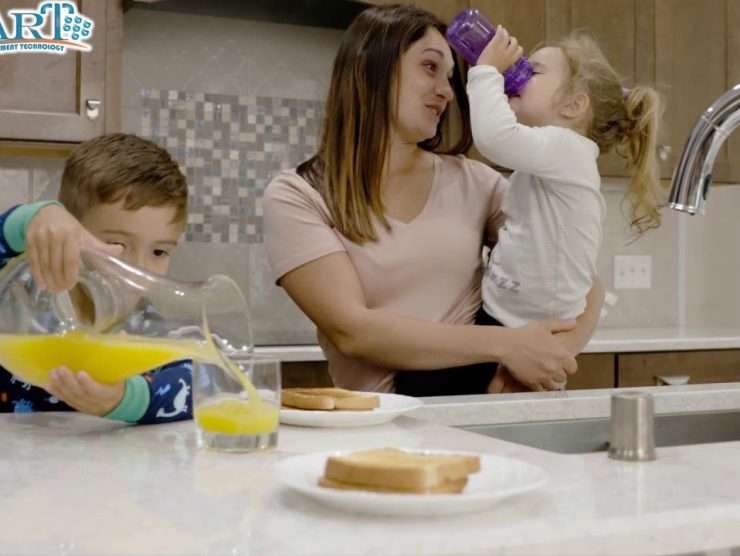 Family drinking water from tap