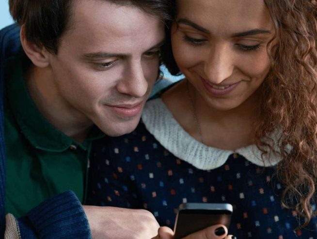 photo for wife and husband checking status of softener using their mobile