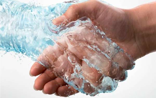 Smart water Treatment photo shows water shake hand with human as a symbolic of friendly water treatment